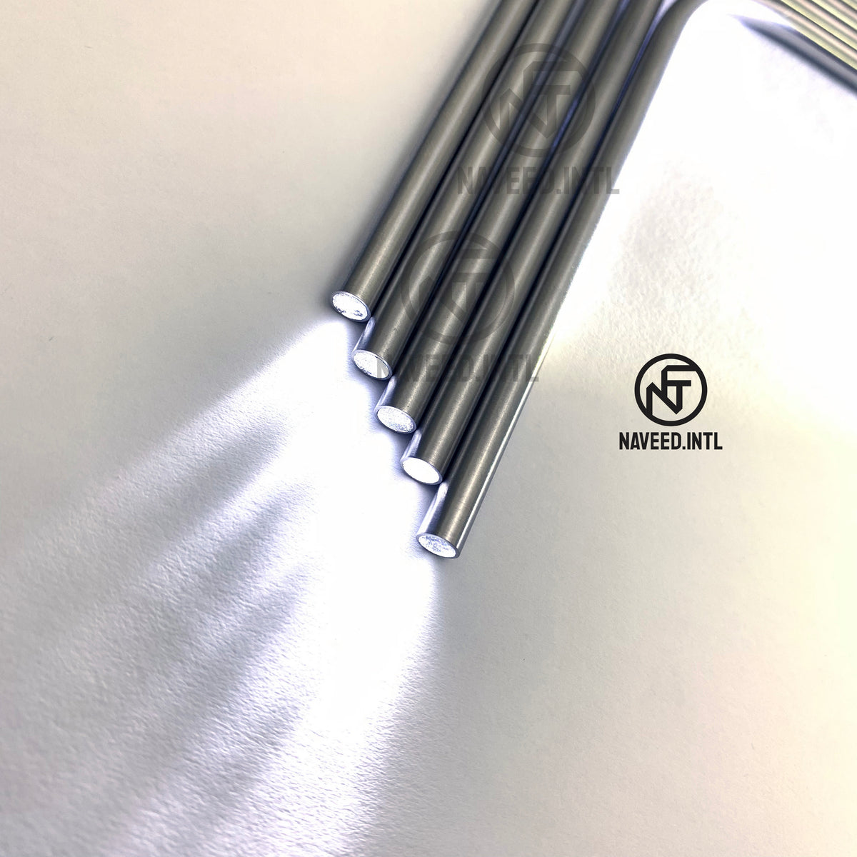 Set of 5 Ferrera breast retractor light pipes showing brightness and smooth fiber optic illumination